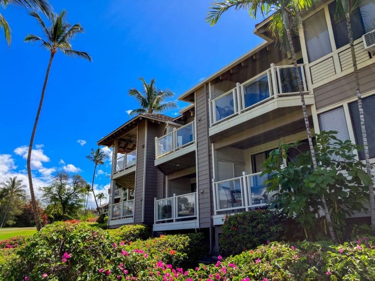 Grand Champions Villas buildings with lanais, palms and bougainvillea in Wailea, Maui