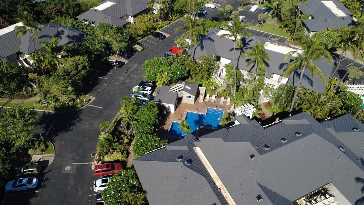 Aerial view of the rectangular family pool and parking at Grand Champions Wailea