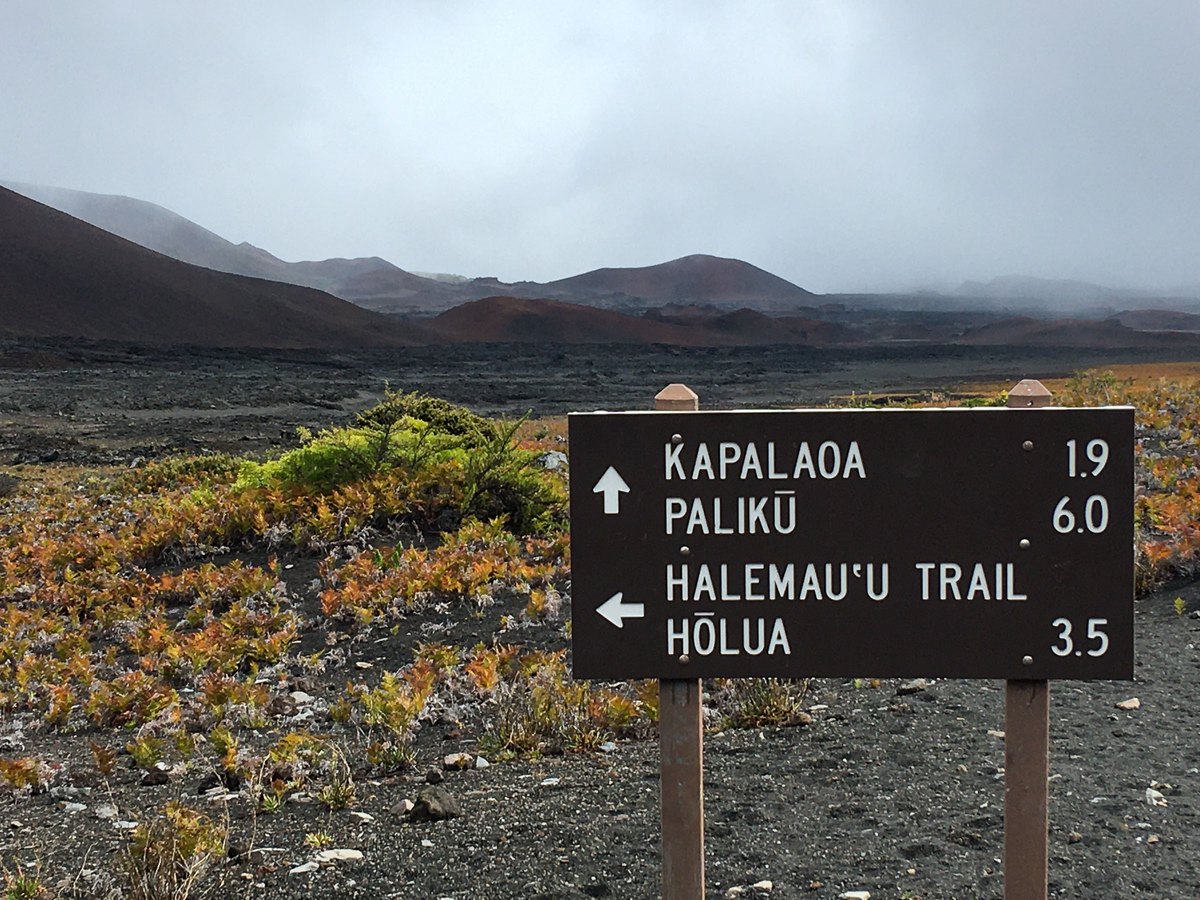 Trail sign in Haleakala Crater pointing to Kapalaoa, Paliku and Holua cabins