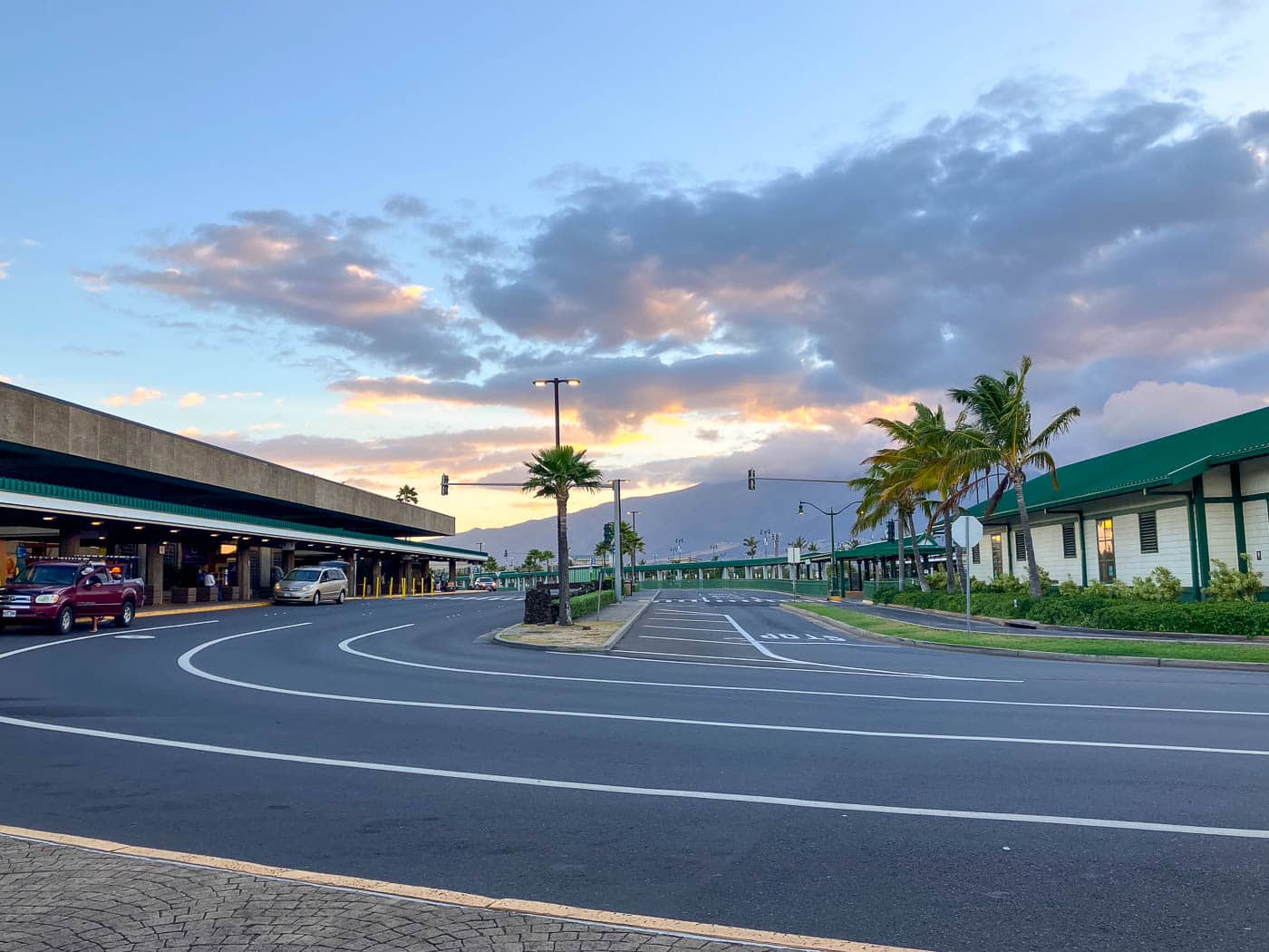 Arrivals curb and pickup lanes at Kahului Airport on Maui at sunset