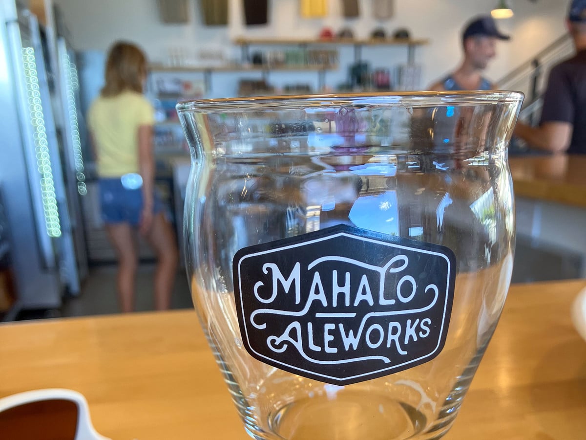 Mahalo Aleworks glass on the taproom bar at the Upcountry Maui brewery