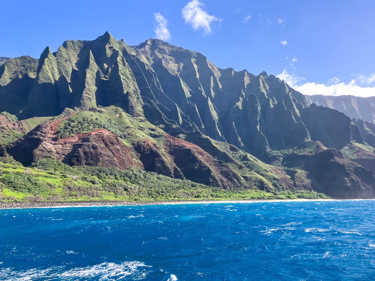 Na Pali Coast cliffs on Kauai seen from the water, a famous Hawaii movie filming location